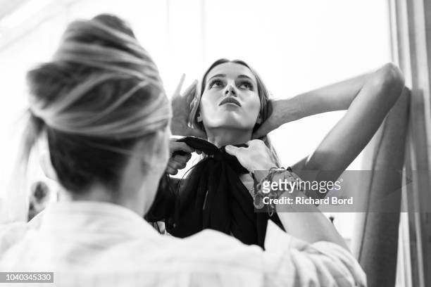 Model prepares backstage before the ETAM show as part of the Paris Fashion Week Womenswear Spring/Summer 2019 on September 25, 2018 in Paris, France.