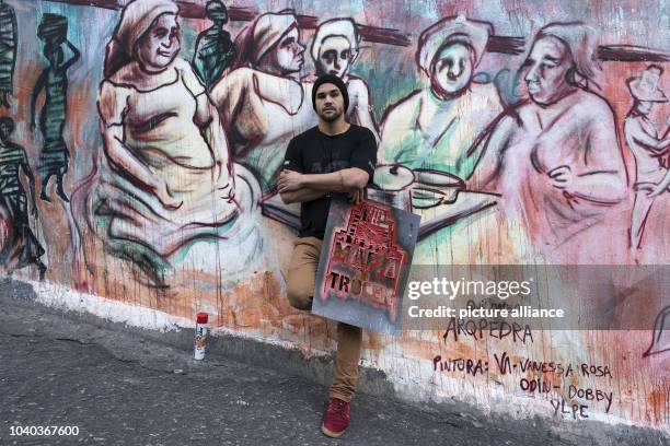 Yohan, a modern graffiti artist, paints every available wall in Rio de Janeiro, Brazil, 07 July 2016. Here is his stencil 'Mafia do Trocen' in front...