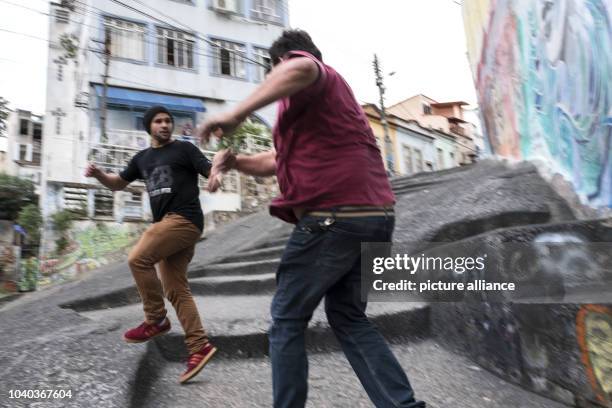 Yohan, a modern graffiti artist, paints every available wall in Rio de Janeiro, Brazil, 07 July 2016. Neighbors don't always love his art. They see...