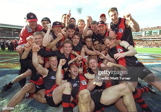 Essendon players celebrate their win, in the AFL Grand Final match between the Essendon Bombers and the Melbourne Demons, played at the Melbourne...