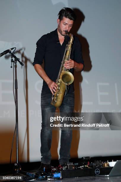 Composer and saxophonist Guillaume Perret performs during the "16 Levers de Soleil" Paris Premiere at Le Grand Rex on September 25, 2018 in Paris,...