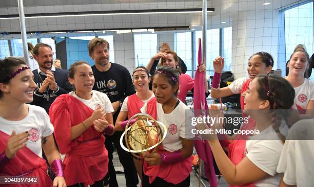 Haakon, Crown Prince of Norway and Actor Nikolaj Coster-Waldau present Goleadoras winning team with a cup during the 3rd Annual Global Goals World...