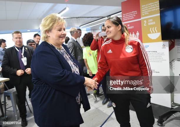 Prime Minister of Norway Erna Solberg greets participants as she attends the 3rd Annual Global Goals World Cup at the SAP Leonardo Centre on...