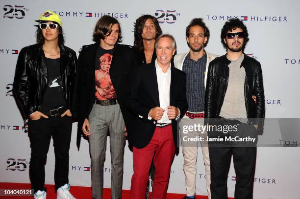 Designer Tommy Hilfiger poses with Julian Casablancas , Nikolai Fraiture , Nick Valensi , Albert Hammond Jr. And Fabrizio Moretti of the Strokes...