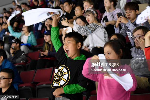 Fan cheers for the Boston Bruins during the game against the Calgary Flames at the Cadillac Arena on September 19, 2018 in Beijing, China.