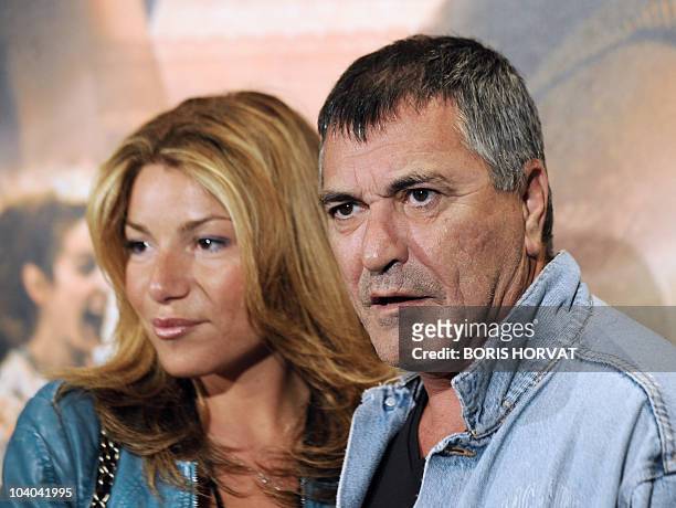 French humorist Jean-Marie Bigard and his wife Claudia pose as they arrive for the premiere of the movie "Ces amours-là" by French director Claude...