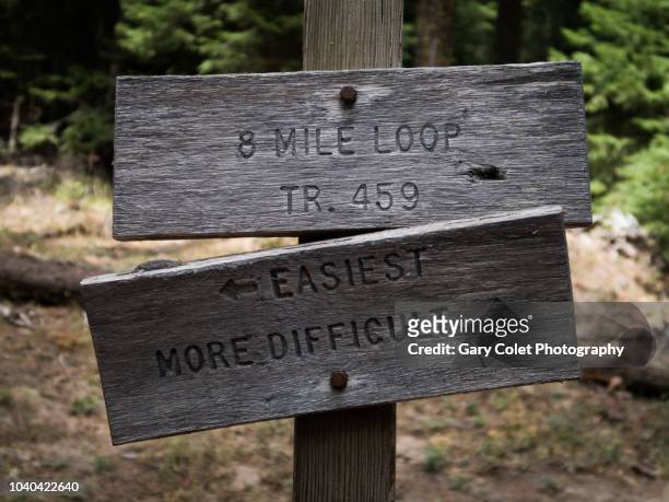 direction sign - difficult or easy route - wooden sign post stock pictures, royalty-free photos & images
