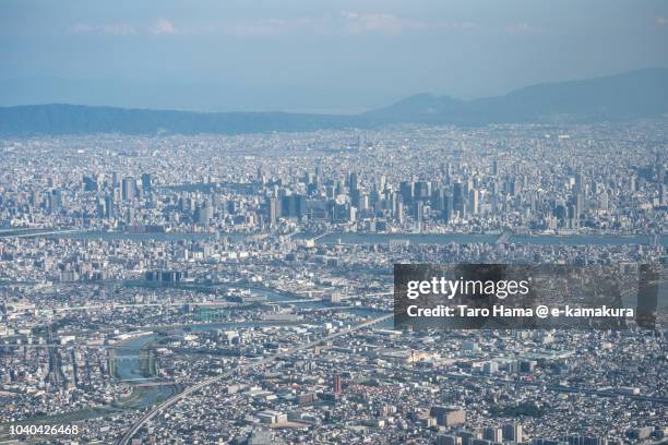 amagasaki city in hyogo prefecture and center of osaka city in osaka prefecture in japan daytime aerial view from airplane - amagasaki fotografías e imágenes de stock