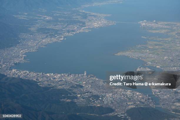lake biwa in shiga prefecture in japan daytime aerial view from airplane - omi stock pictures, royalty-free photos & images