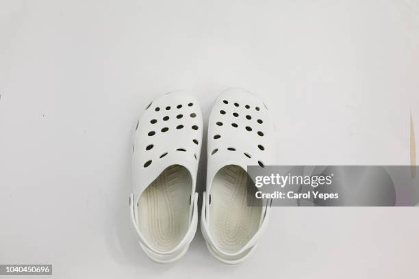 doctor´s clogs.white medical shoes - schuhpflege stock-fotos und bilder