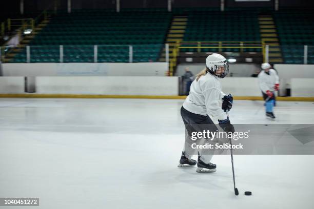 ice hockey training - hockey pucks practice stock pictures, royalty-free photos & images