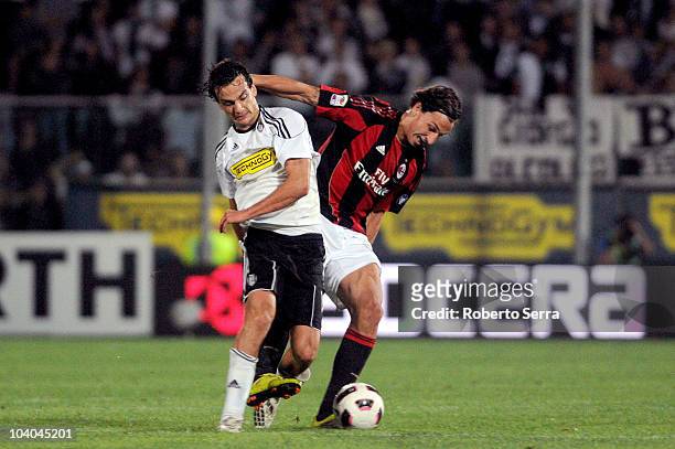 Zlatan Ibrahimovic of AC Milan competes with Marco Paroloi of Cesena during the Serie A match between AC Cesena and AC Milan at Dino Manuzzi Stadium...