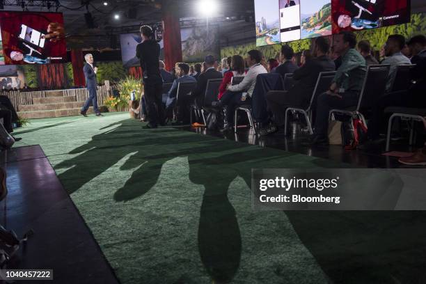 Parker Harris, co-founder and chief technology officer of Salesforce.com Inc., left, speaks during the opening keynote at the DreamForce conference...