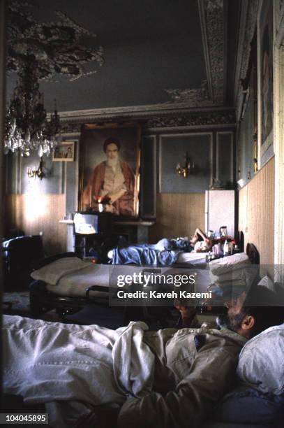 Member of the Iranian Basiji paralized in the Iran-Iraq war, reads the Qoran at a special clinic run by the Martyrs Foundation for war handicapped in...