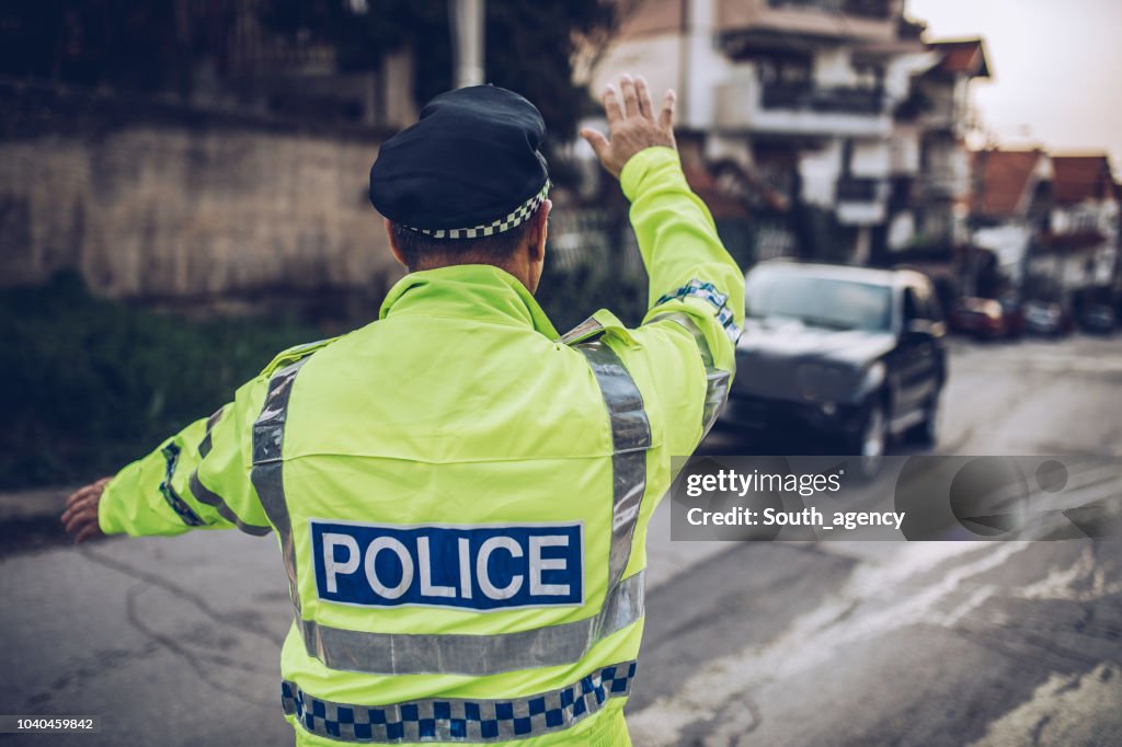 Traffic police pulling car over