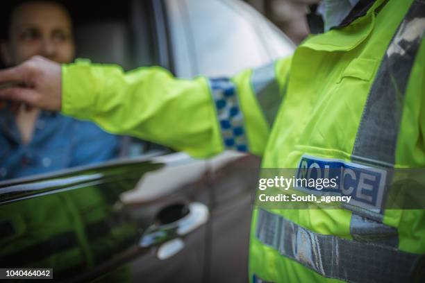 police giving a speeding ticket - military uniform close up stock pictures, royalty-free photos & images