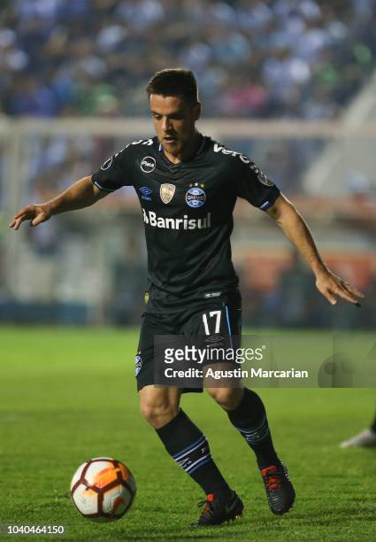 Ramiro of Gremio drives the ball during a quarter final first leg match between Atletico Tucuman and Gremio as part of Copa CONMEBOL Libertadores...