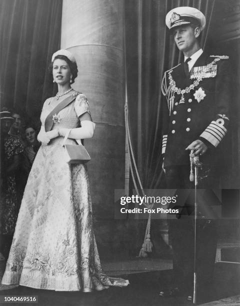 Queen Elizabeth II and Prince Philip leaving Parliament House, Wellington, after the Queen had opened a special session of the New Zealand...