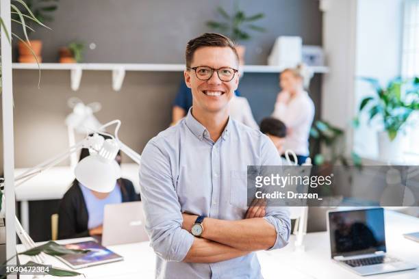 portrait of finish or scandinavian businessman with colleagues in office - scandinavian culture stock pictures, royalty-free photos & images