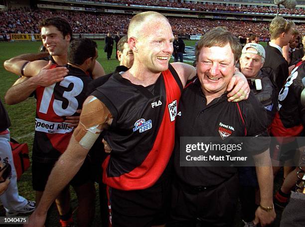 Dean Wallis for Essendon celebrates with Coach Kevin Sheedy after their win, in the AFL Grand Final match between the Essendon Bombers and the...