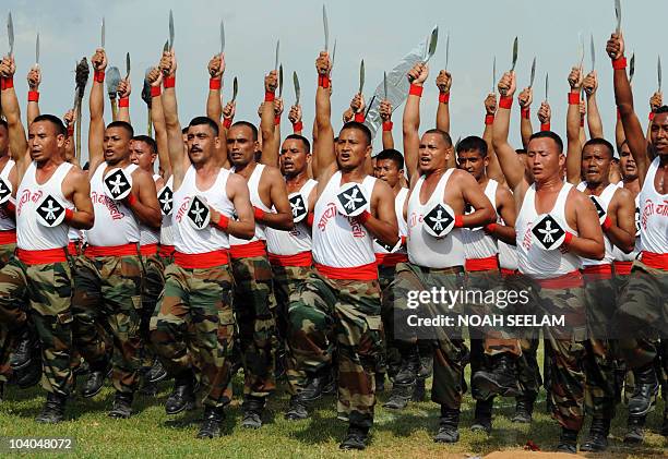 Indian soldiers of the 4/9 Gurkha Regiment perform the traditional "khukhari" dance at the Prince Berar Polo Cup final in Hyderabad on September 12,...