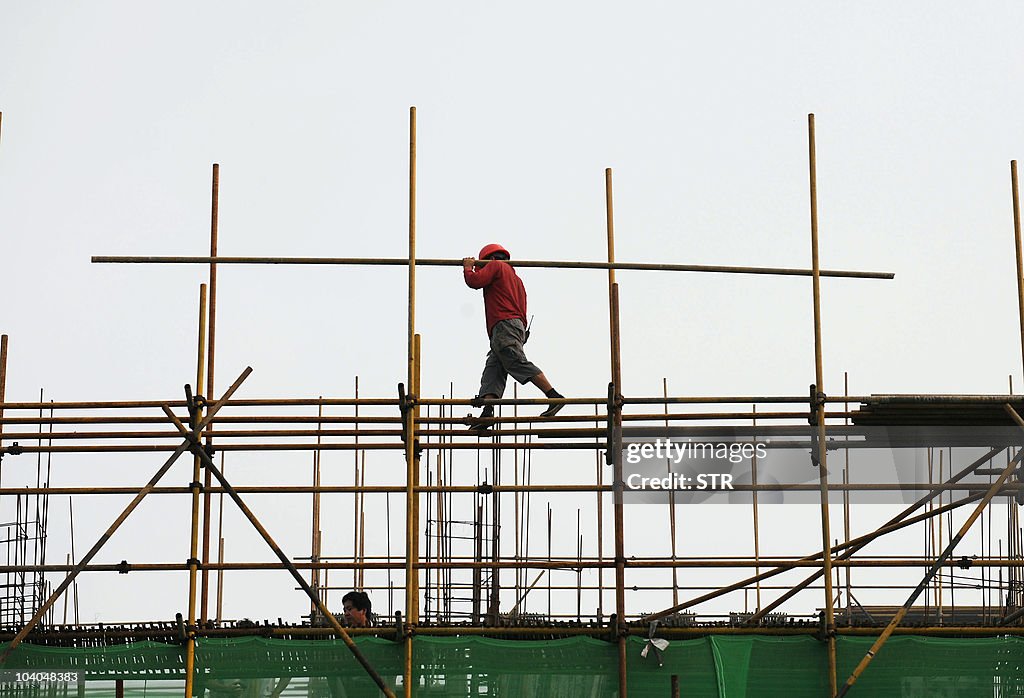 A Chinese worker goes about his chores a