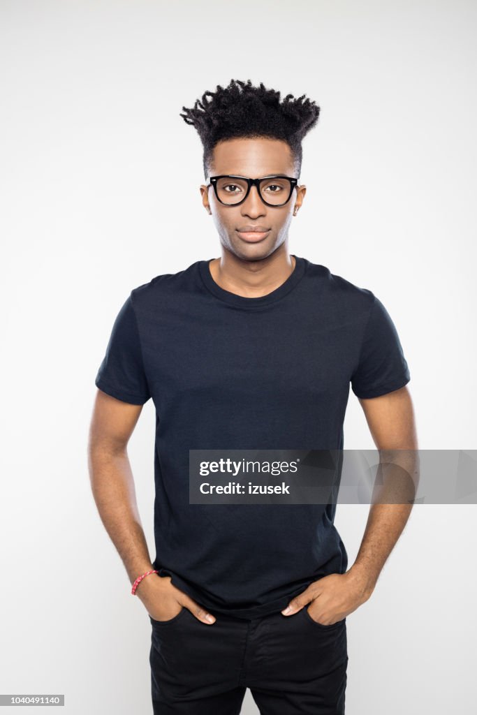 Handsome guy with funky hairstyle and nerd glasses