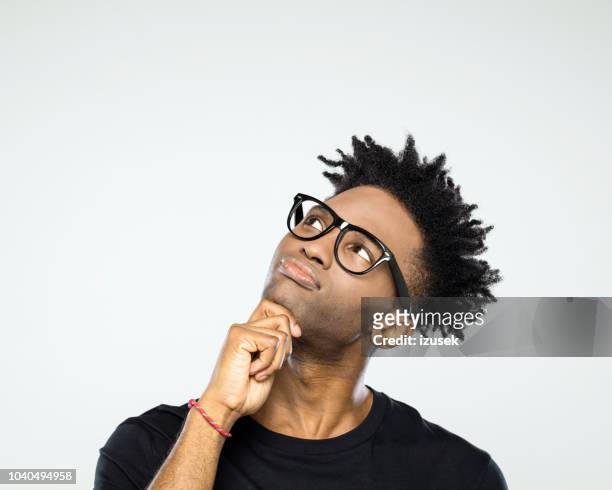 pensive afro american man looking up at copy space - problems imagens e fotografias de stock