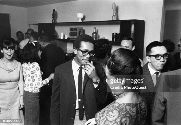 View of American social worker Ernest Green as he attends a party, New York, New York, 1965. Green was member of the Little Rock Nine and became the...
