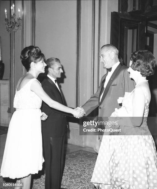 View of, from left, Empress consort of Iran Farah Pahlavi and Shah of Iran Mohammad Reza Pahlavi greet US Vice President Lyndon B Johnson and First...