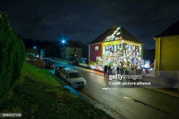 View of the decorated house of local resident Sven Berrar in Voelklingen, Germany, 30 November 2015. Aboput 46,000 small lights and 120 illuminated...