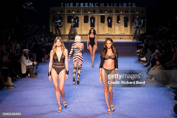 Constance Jablonski and Joan Smalls walk the runway during the ETAM show as part of the Paris Fashion Week Womenswear Spring/Summer 2019 on September...