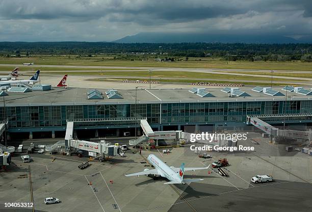 An Air Canada Embraer 190 jet aircraft taxis to a Vancouver International Airport gate on July 7, 2010 in Vancouver, British Columbia, Canada....