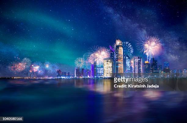 abu dhabi at night with fireworks - abu dhabi stock pictures, royalty-free photos & images