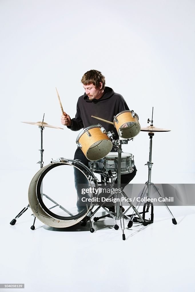 A Young Man Playing The Drums
