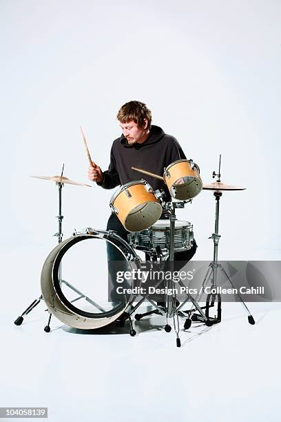 a young man playing the drums - drums white background stock pictures, royalty-free photos & images