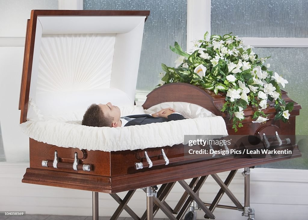 A Deceased Man Laying In A Coffin