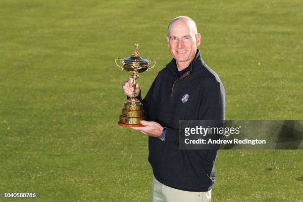 Captain Jim Furyk of the United States poses with the Ryder Cup during a photocall ahead of the 2018 Ryder Cup at Le Golf National on September 26,...