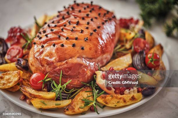 christmas dinner with glazed holiday ham with cloves, vegetables, minced pies and eggnog orange trifle - glazed ham imagens e fotografias de stock