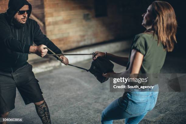 criminal stealing a purse - mugger stock pictures, royalty-free photos & images