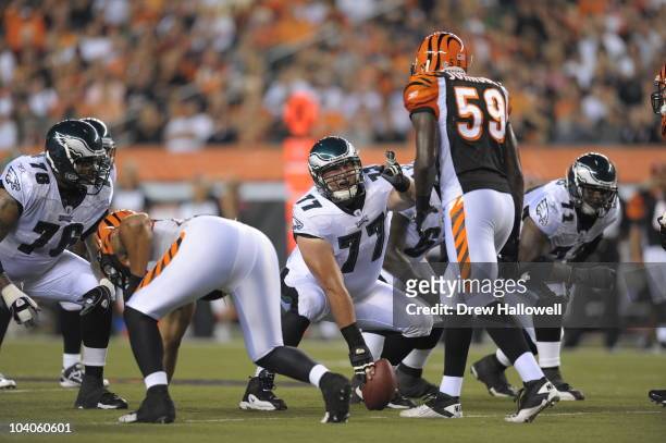Guard Mike McGlynn of the Philadelphia Eagles signals during the game against the Cincinnati Bengals on August 20, 2010 at Paul Brown Stadium in...