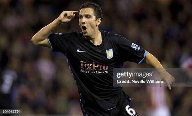 Stewart Downing of Aston Villa celebrates scoring the opening goal during the Barclays Premier League match between Stoke City and Aston Villa at the...