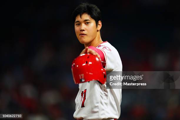 Shohei Ohtani of the Los Angeles Angels of Anaheim looks on during the game against the Texas Rangers at Angel Stadium on September 25, 2018 in...