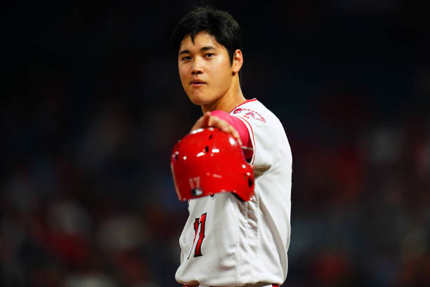 Shohei Ohtani of the Los Angeles Angels of Anaheim looks on during the game against the Texas Rangers at Angel Stadium on September 25, 2018 in...