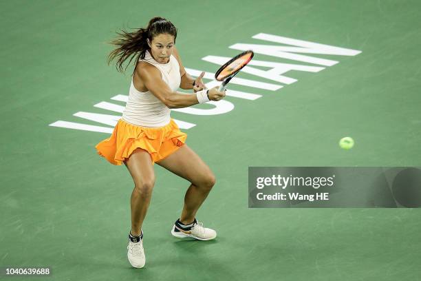 Daria Kasatkina of Russia returns a shot against Dominika Cibulkova of Slovakia during 2018 Wuhan Open at Optics Valley International Tennis Center...