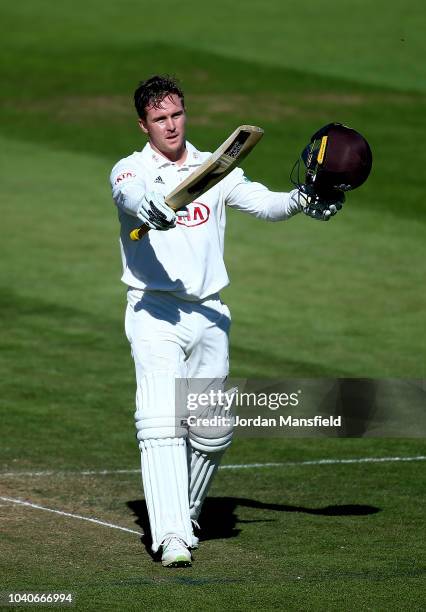Jason Roy of Surrey celebrates his century during day three of the Specsavers County Championship Division One match between Surrey and Essex at The...