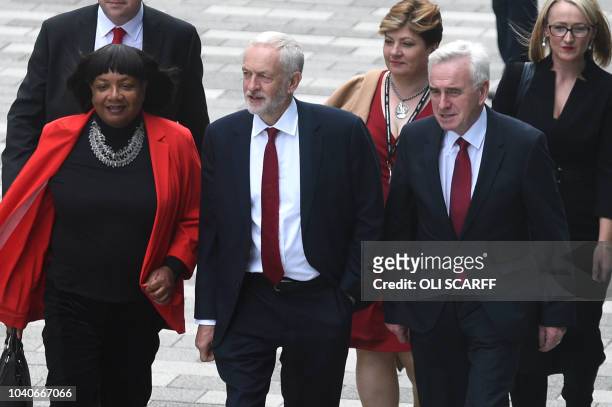 Britain's opposition Labour Party leader Jeremy Corbyn arrives with shadow home secretary Diane Abbott and shadow chancellor John McDonnell at the...