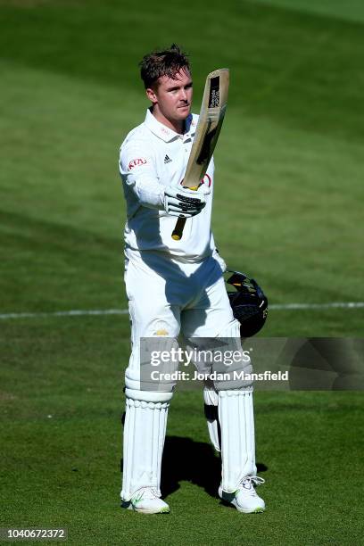 Jason Roy of Surrey celebrates his century during day three of the Specsavers County Championship Division One match between Surrey and Essex at The...