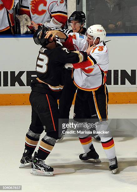Ryley Grantham of the Calgary Flames gets in the face of defenseman Mat Clark of the Anaheim Ducks during game 3 of the Young Stars Tournament at the...