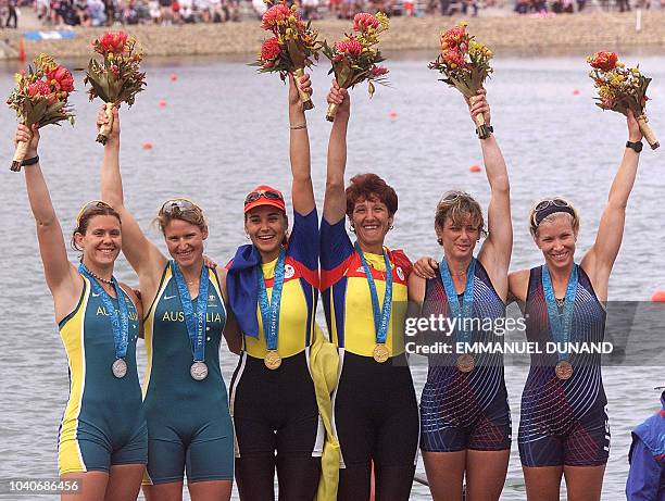 Romanian gold-medal rowers Georgeta Damian and Doina Ignat , with Australia's silver-medallist Rachael Taylor and Kate Slatter and US...